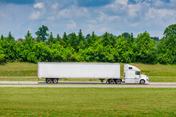 istock White Tractor-Trailer Truck With Great Copy Space 1261600129