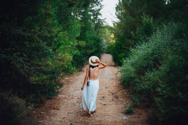 istock Woman Walking in the Forest 1261605170