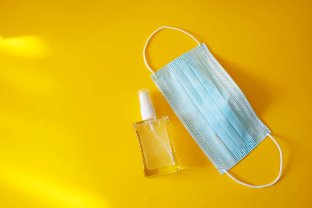 istock Hand sanitizer and medical protective mask 1261605227