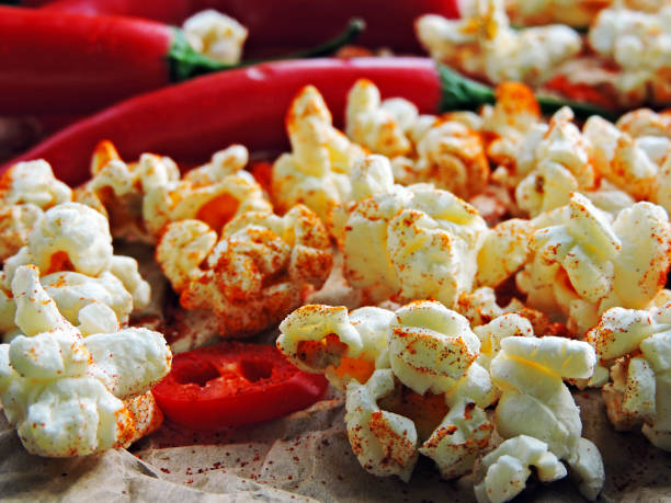 Spicy hot popcorn with chili pepper. stock photo