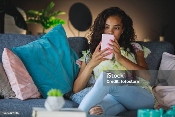 Checking Notifications From All The Social Networks Before Going Back To Daily Duties Stock Photo - Download Image Now