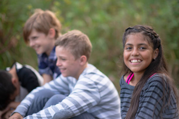istock Kids laughing together in a natural outdoor setting 1261654789