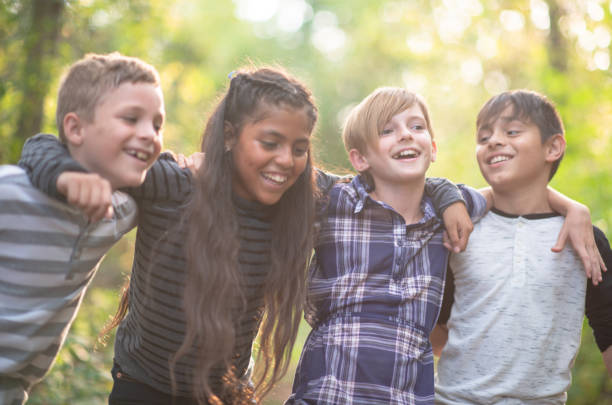 istock Kids having fun together in the woods 1261654807