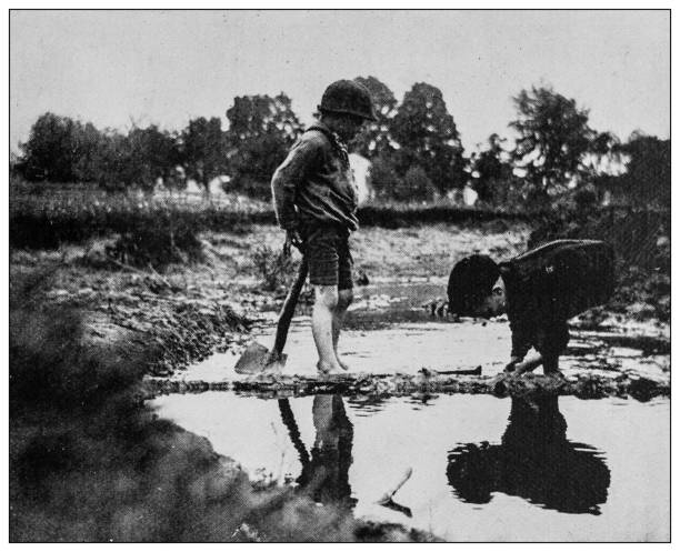 istock Antique black and white photo: Children playing 1261655361
