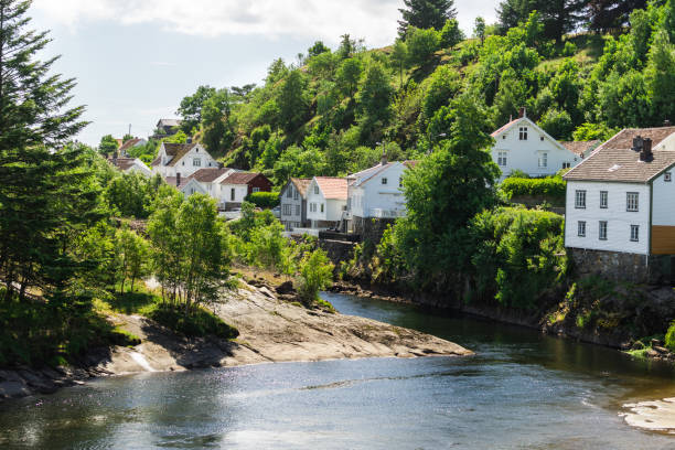 istock Norwegian white houses on river shore 1261658207