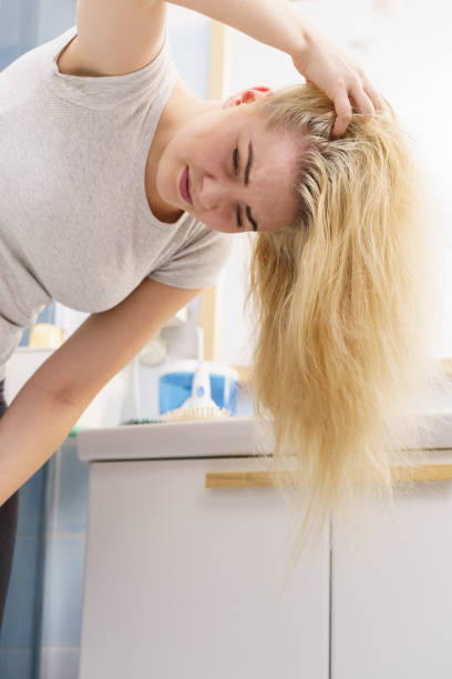 istock Female having problem with blonde hair 1261662250