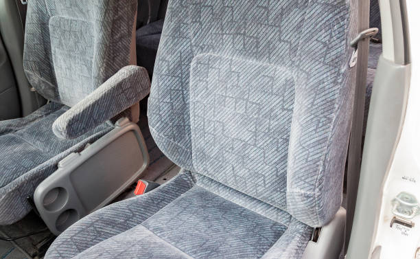 istock Comfortable front seats inside the car: the driver and passenger, tied with textile velour, modern interior design in workshop. Auto service industry. 1261671132