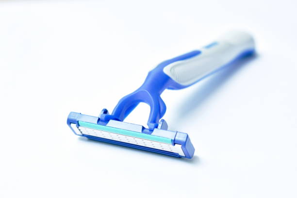 istock blue plastic shaver isolated on white background 1261672785