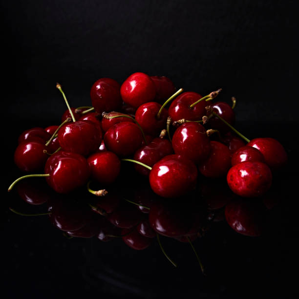 istock cherry still life on black background 1261673883