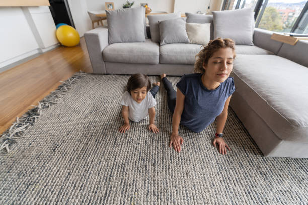 istock Mother and son meditating at home 1261687195