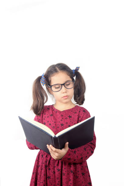 istock Cute Girl Reading a Book 1261689465