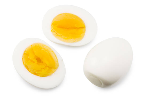 istock Single whole boiled egg with halved egg isolated on a white background. Top view 1261689543