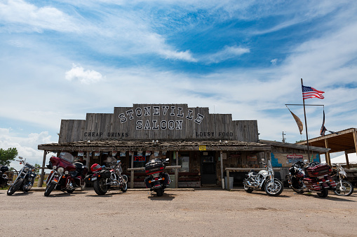Alzada, Montana - August 8, 2014: Motorcycles parked in front of the Stoneville Saloon, in the State of Montana