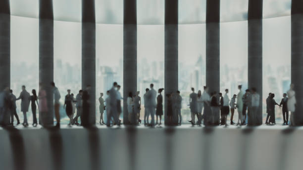 istock Defocused business people in the office lobby 1261698185