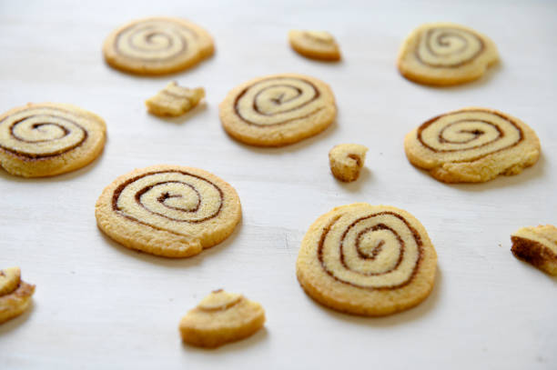 istock Shortbread cookies with cinnamon on a white wooden background. Cookie pattern. Selective focus. 1261698221