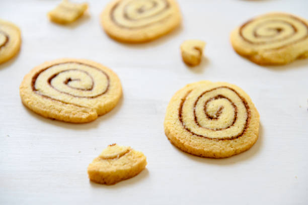 istock Shortbread cookies with cinnamon on a white wooden background. Cookie pattern. Selective focus. 1261698742
