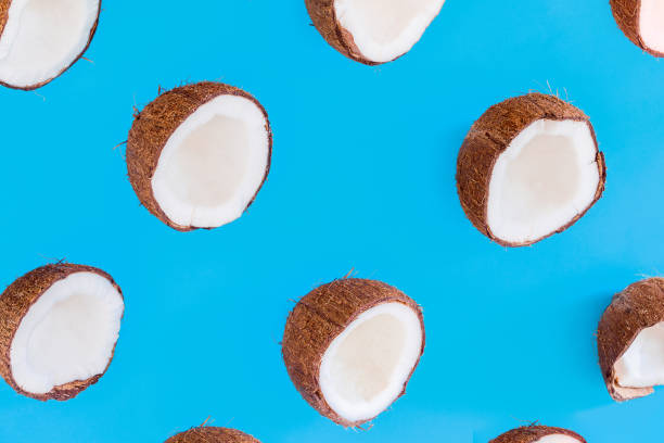 istock Exotic coconut isolated on blue background 1261698763