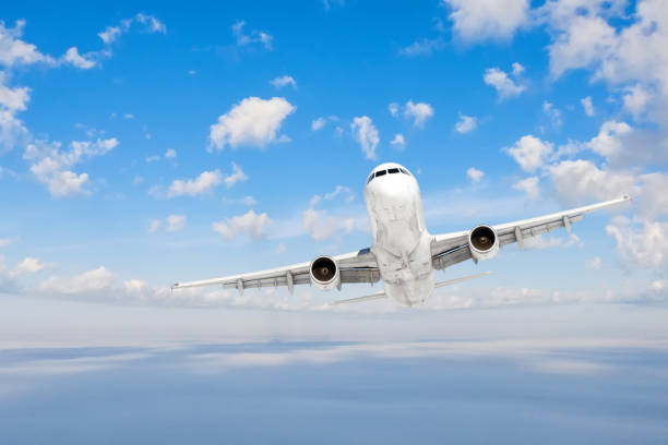 istock The plane flies straight, gaining altitude through a dense layer of clouds. 1261709174