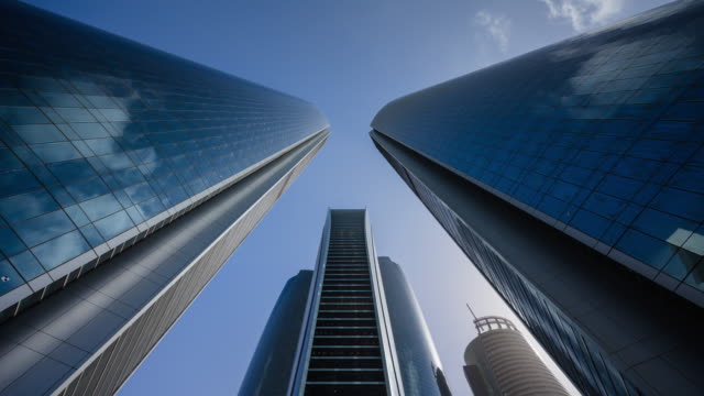 4K timelapse High modern finance skyscrapers over blue sky,ABU dhabi,UAE