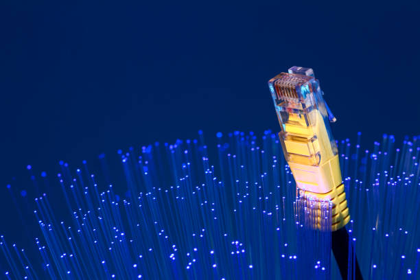 istock Fibre optic strands with a ethernet lan broadband cable 1261717015
