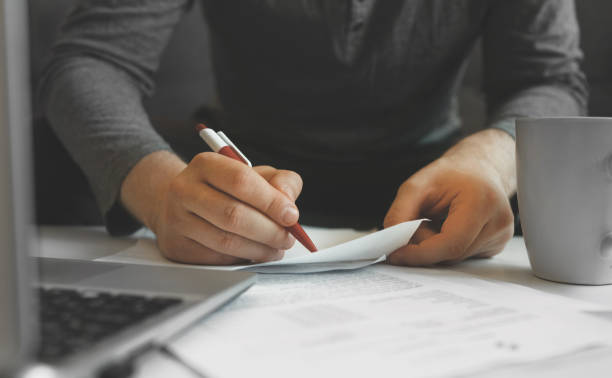 istock Businessman working with papers. Signing the contract. 1261717074