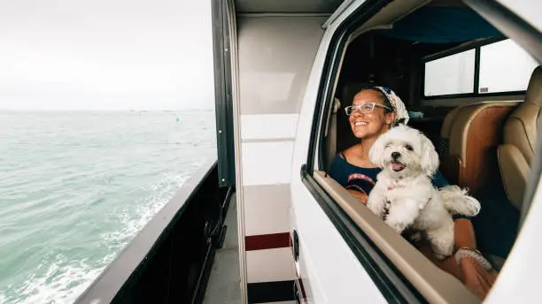 Family on RV Road Trip during summer vacation. Crossing on free ferry ride service to Outer Banks in North Carolina.