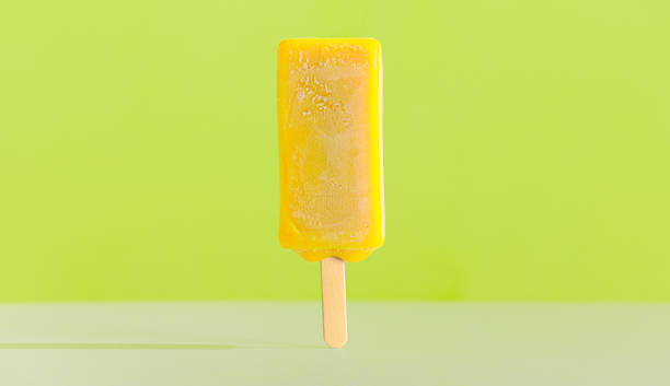 istock Yellow bright ice cream on a stick. Lemon taste 1261717959