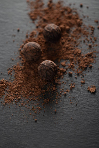 istock Chocolate candy truffle with cocoa powder on a grey background 1261720342