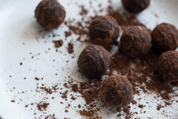 istock Chocolate candy truffle with cocoa powder on a grey background 1261720358