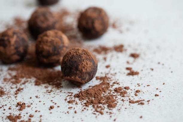 istock Chocolate candy truffle with cocoa powder on a grey background 1261720411