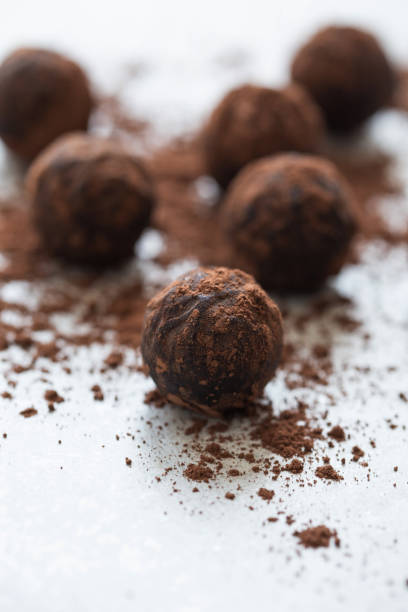 istock Chocolate candy truffle with cocoa powder on a grey background 1261720412
