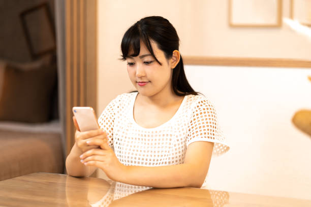 istock A woman looking at a smartphone 1261730451