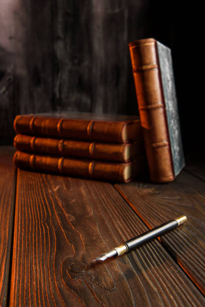 istock books and pen for writing 1261731525