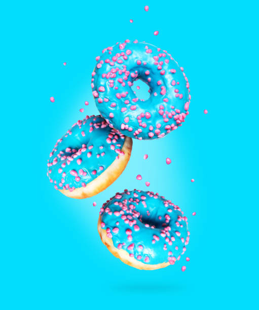 istock Donuts in the air on a blue background 1261736784
