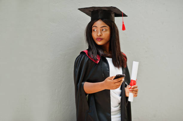 istock Young female african american student with diploma 1261769415