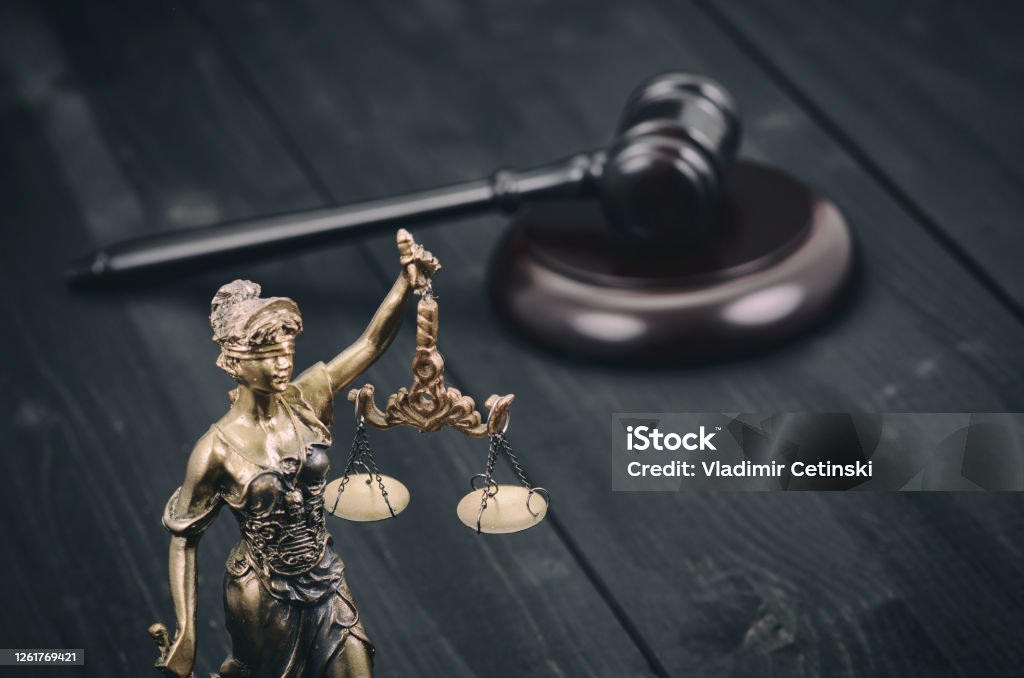 Scales of Justice, Judge Gavel, Justitia, Lady Justice on a black wooden background. Law and Justice, Legality concept, Scales of Justice, Judge Gavel, Justitia, Lady Justice on a black wooden background. Disability Stock Photo