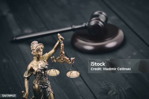 Scales Of Justice Judge Gavel Justitia Lady Justice On A Black Wooden Background Stock Photo - Download Image Now