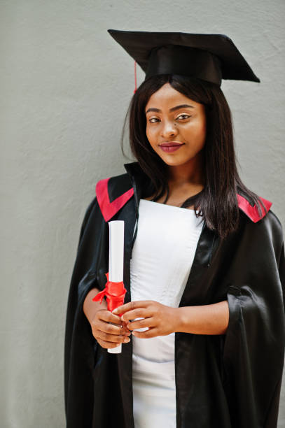 istock Young female african american student with diploma 1261769950