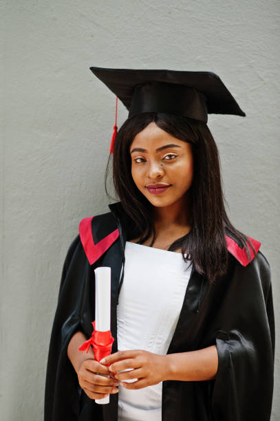 istock Young female african american student with diploma 1261769966