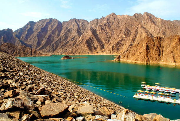 istock Beautiful deep green Hatta lake between Hajar Mountains 1261783961