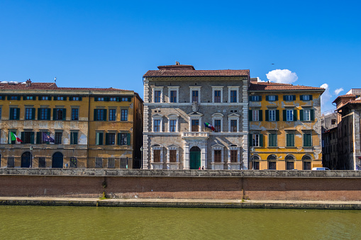 Pisa, Italy - August 14, 2019: The Palazzo Lanfreducci, also called the Palazzo Upezzinghi or Palazzo Alla Giornata on the bank of Arno river in Pisa