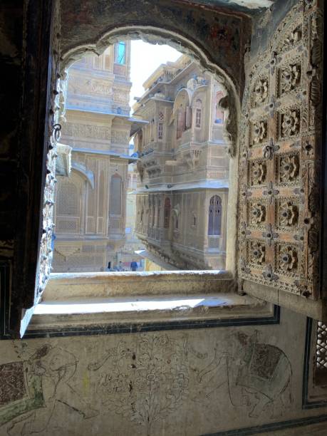 Jaisalmer window Ancient Indian design window of a palace open to the narrow streets of Jaisalmer abbottabad stock pictures, royalty-free photos & images