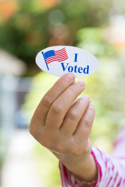 istock Hand holding I voted today sign 1261813260