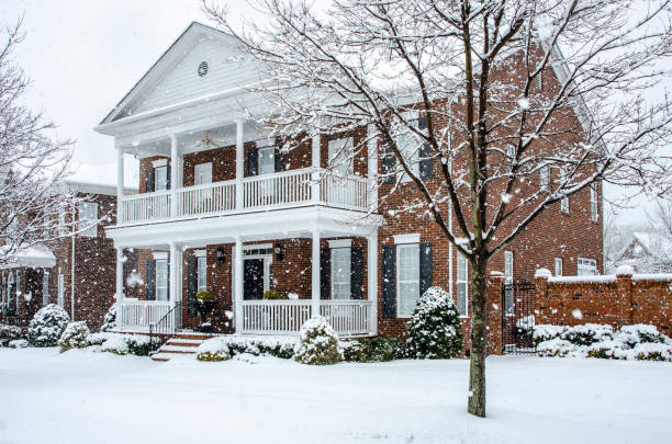 istock Traditional Brick Home During a Winter Snow Storm 1261822535