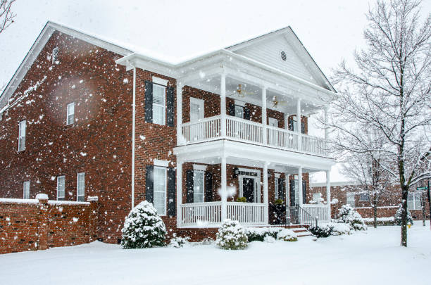 istock Traditional Brick Home During a Winter Snow Storm 1261822547