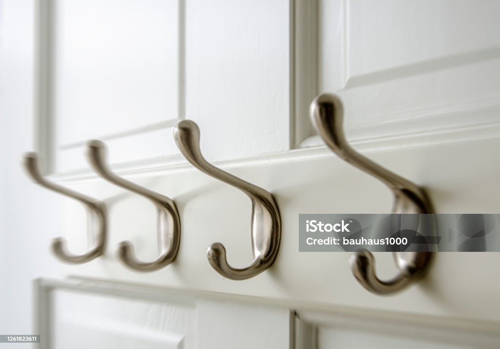 Bedroom Closet: Coat Hooks on the back of a closet door. Coat Hook Stock Photo