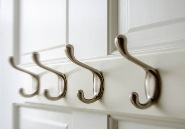 Bedroom Closet: Coat Hooks on the back of a closet door. Bedroom Closet: Coat Hooks on the back of a closet door. coat hook photos stock pictures, royalty-free photos & images