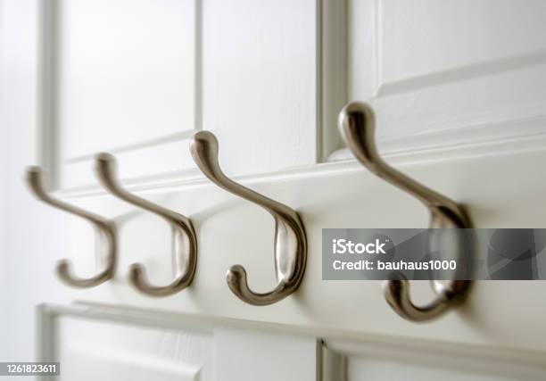 Bedroom Closet Coat Hooks On The Back Of A Closet Door Stock Photo - Download Image Now