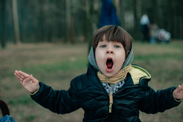 istock A little child is drinking hot tea in nature. 1261842883
