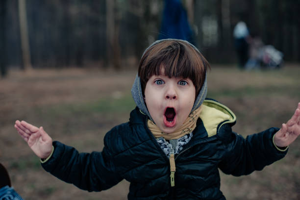 istock A little child is drinking hot tea in nature. 1261844488